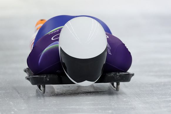 Dan Barefoot sliding head-first down the ice track